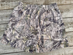 back of BD Athletic Dept camouflage shorts on a wooden surface
