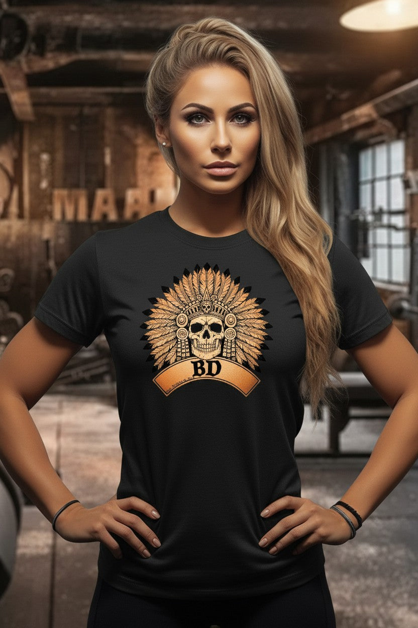 Woman wearing a black t-shirt with a skull and letter 'BD' design in an industrial setting.