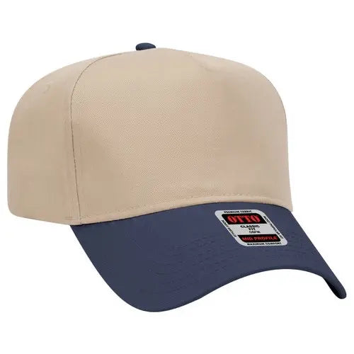 Beige and navy baseball snapback hat with a brand label on a white background