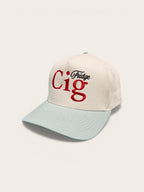 Beige snapback hat with "fridge cig" text and seafoam brim on a white background