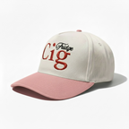 Beige snapback hat with "fridge cig" text and pink brim on a white background