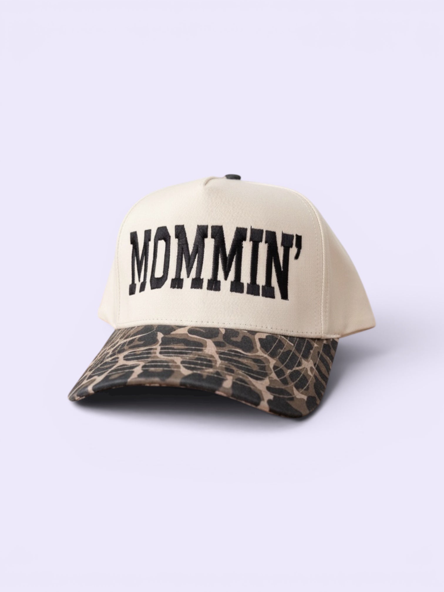 Beige snapback hat with leopard print brim and 'MOMMIN' text on a white background
